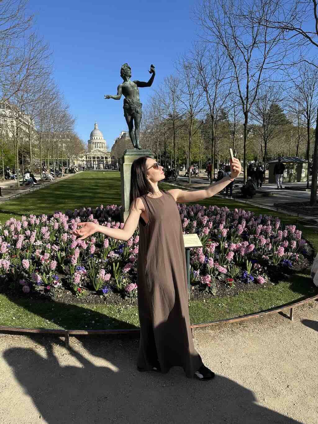 Visitors enjoying a sunny afternoon in the Luxembourg Gardens