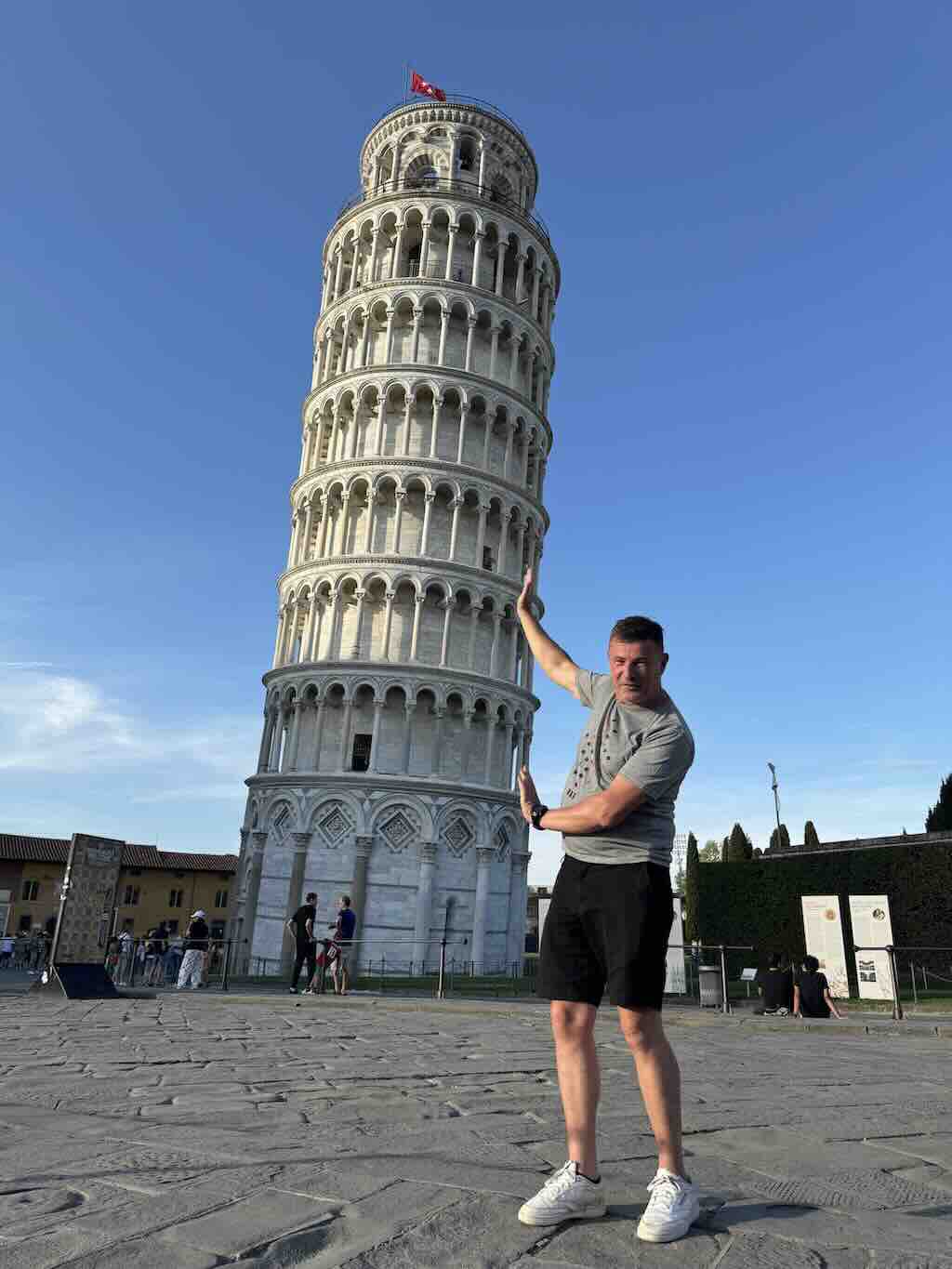 Blaise Jaeger pretending to hold up the Leaning Tower of Pisa