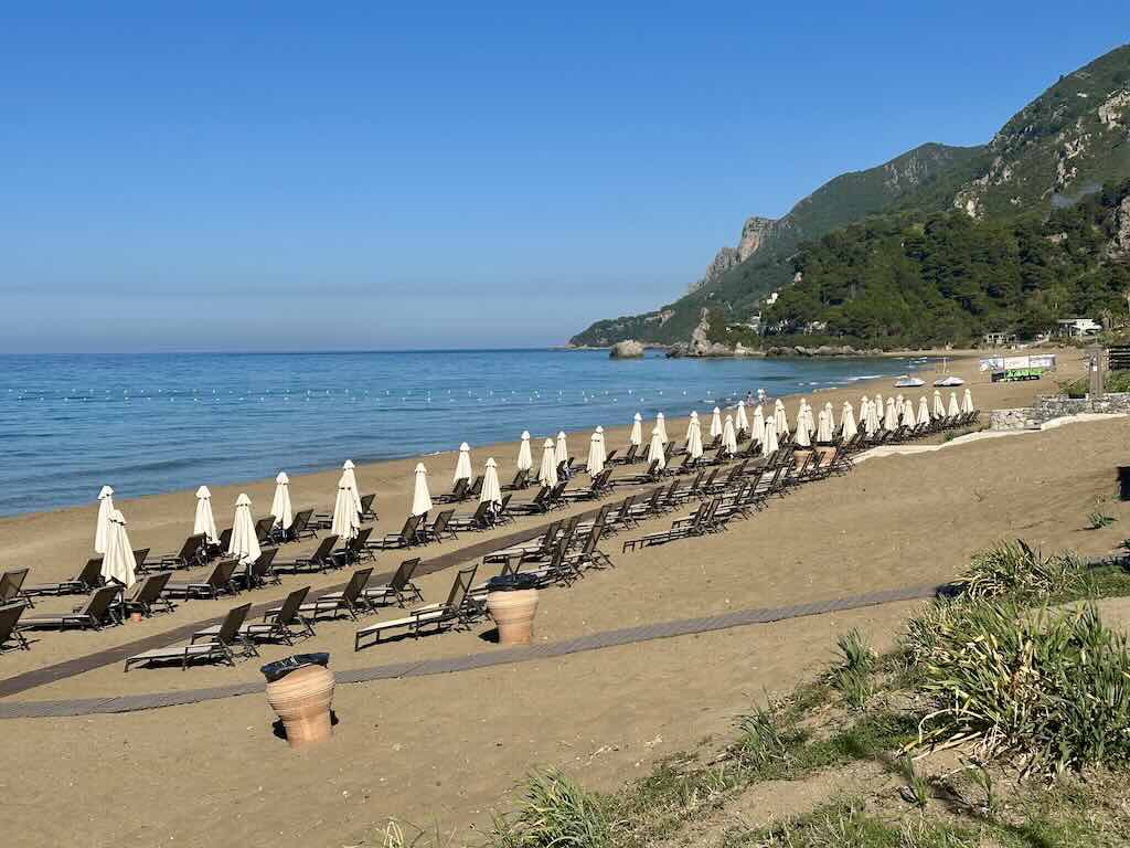 Glyfada Beach Corfu Greece sandy beach sunbeds Ionian Sea