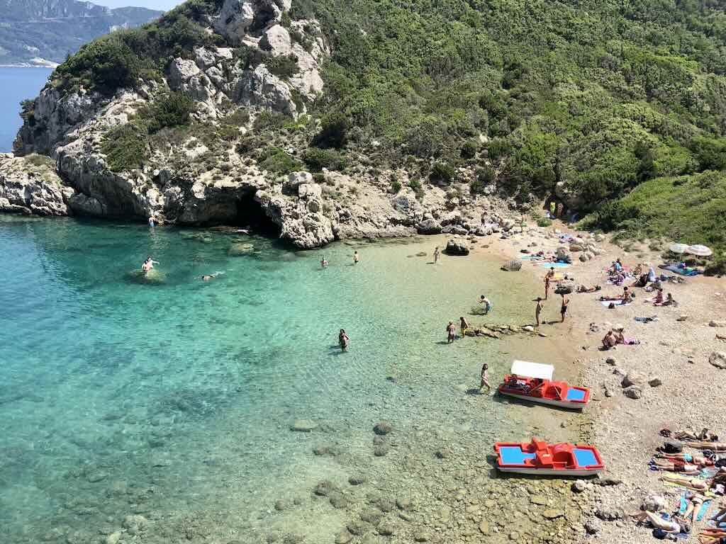 Two pedal boats on Porto Timoni beach with turquoise waters, Corfu