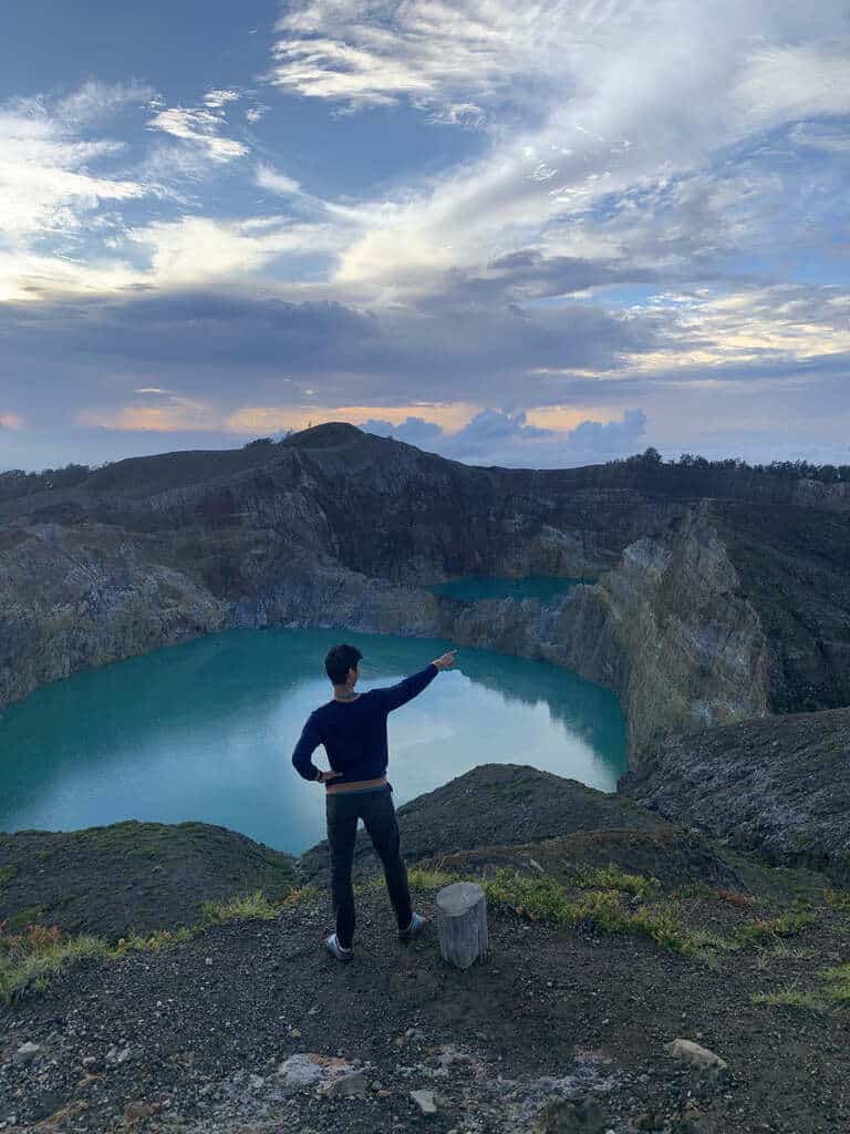 Travelers at the crater rim of Kelimutu at dawn, Flores