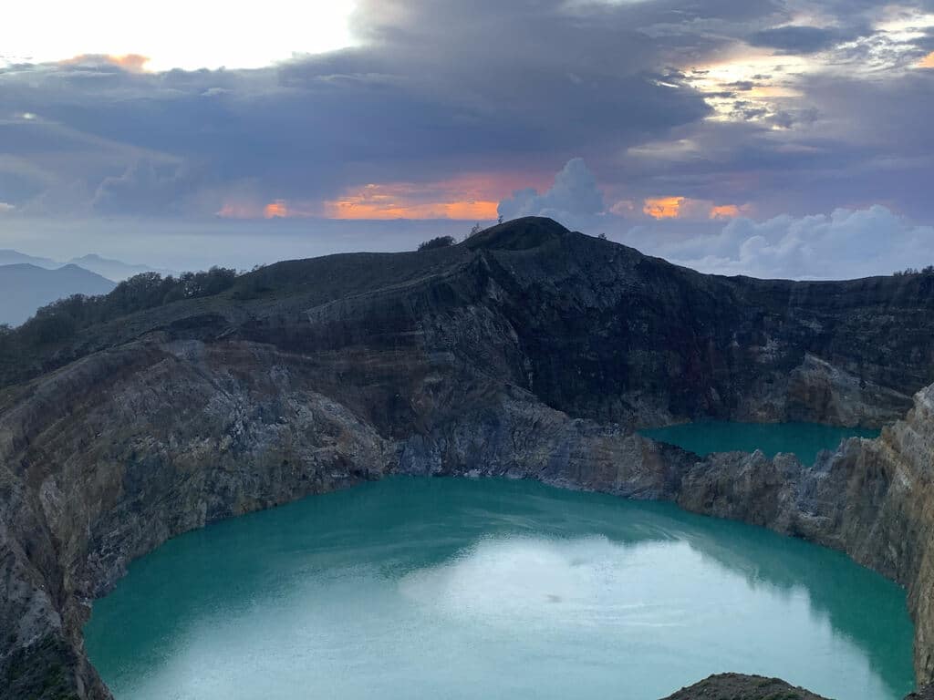 Sunrise colors over a crater lake of Kelimutu, Flores