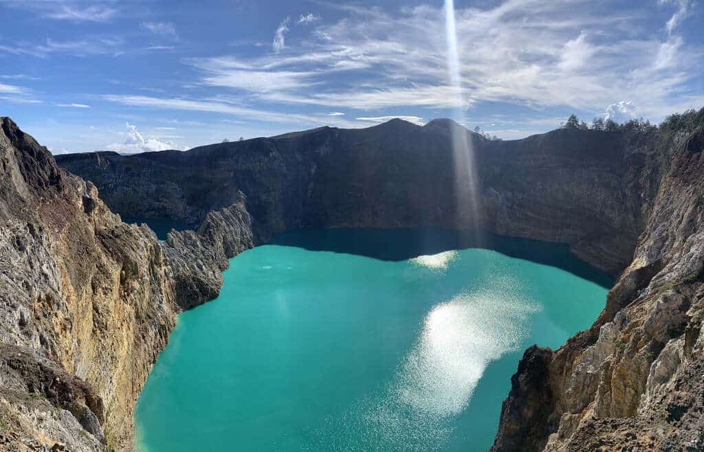 Saturated turquoise water of a Kelimutu crater lake in morning light