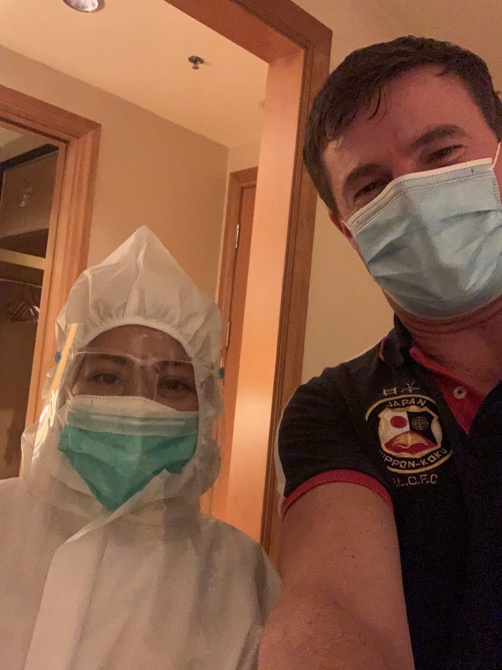 Hotel staff in full protective equipment during mandatory Covid quarantine in Jakarta, Java