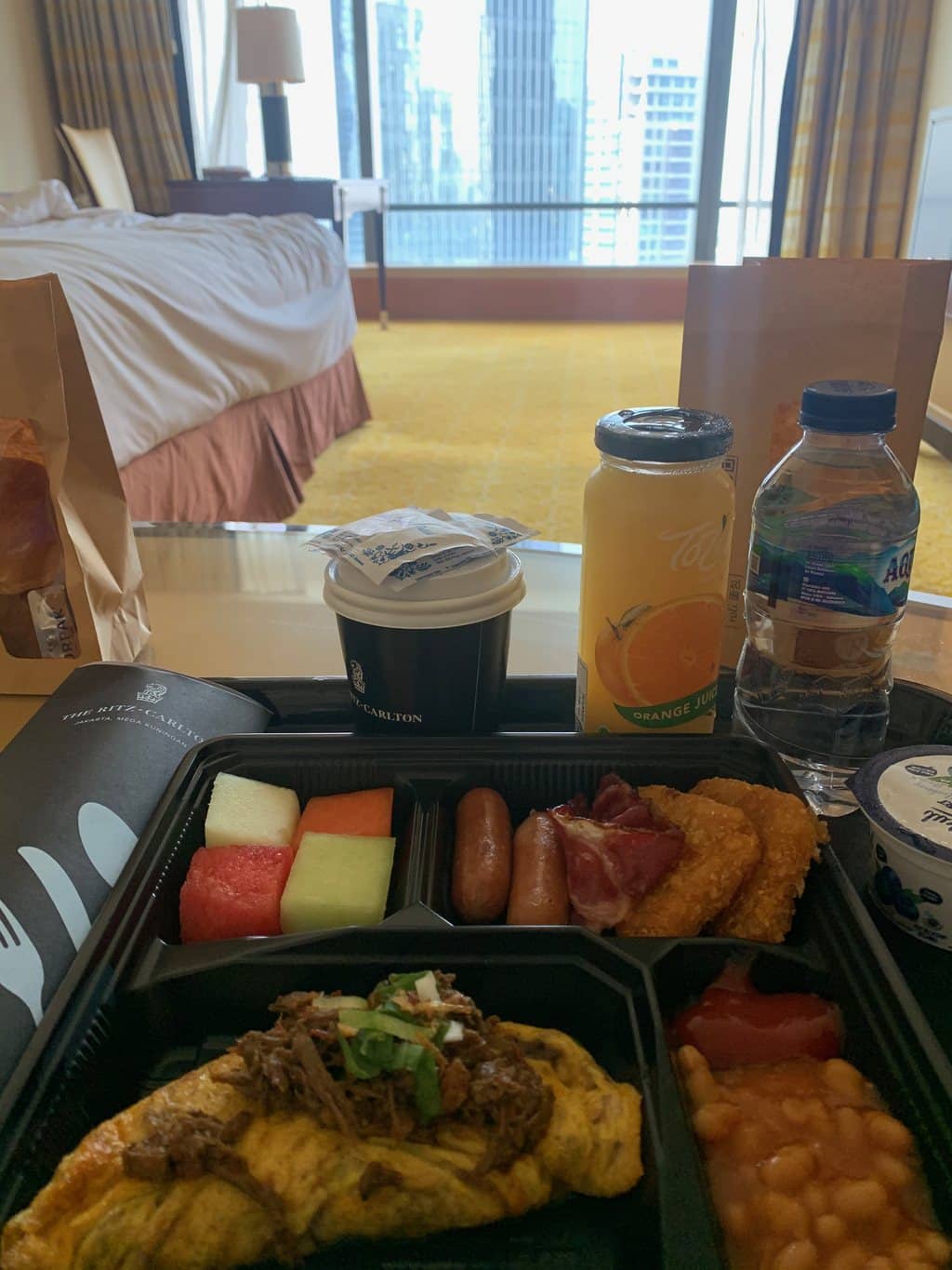 Room service tray by the window during quarantine in a Jakarta hotel, Java