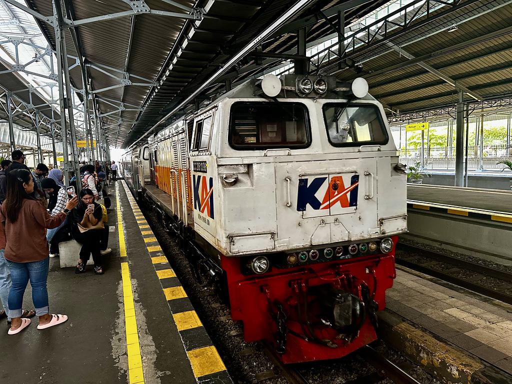 A KAI diesel locomotive at the platform of Yogyakarta Tugu railway station, Java, Indonesia