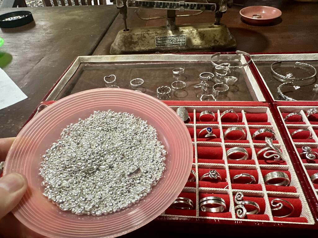 Silver granules weighed beside finished rings, Sidemen workshop Bali