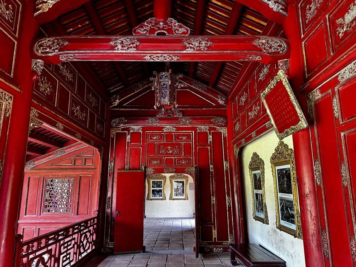 A long red lacquered corridor inside the Hue Imperial City