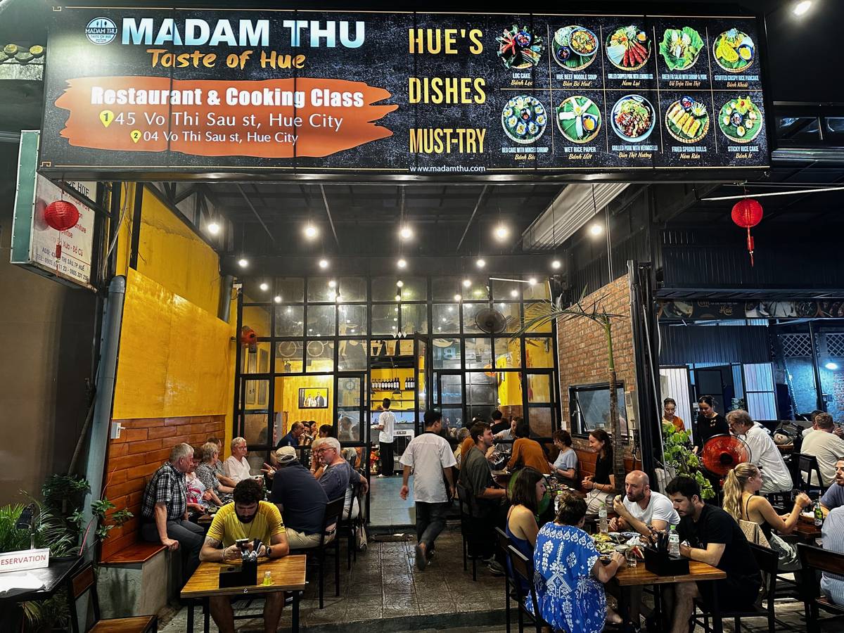 The busy dining room of Madam Thu restaurant in Hue at night