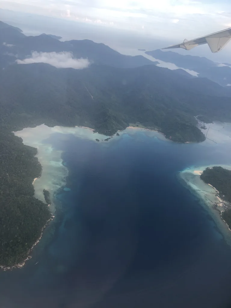 The Anambas Islands and their reefs seen from a plane window