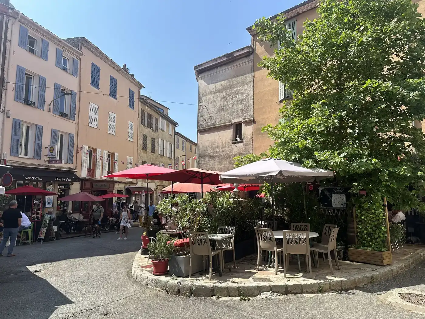 Café terraces and old houses on a square in Aups, Haut-Var
