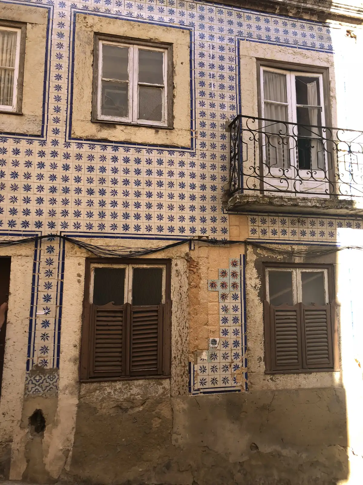 Old Lisbon house facades covered in azulejo tiles