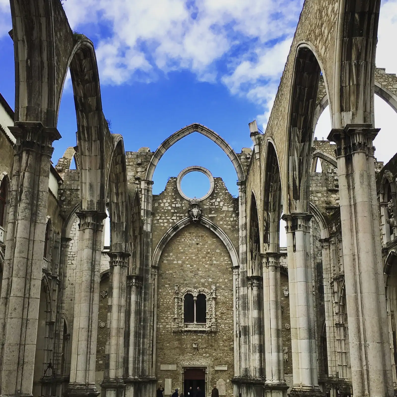 The roofless Gothic arches of the Carmo convent ruins in Lisbon