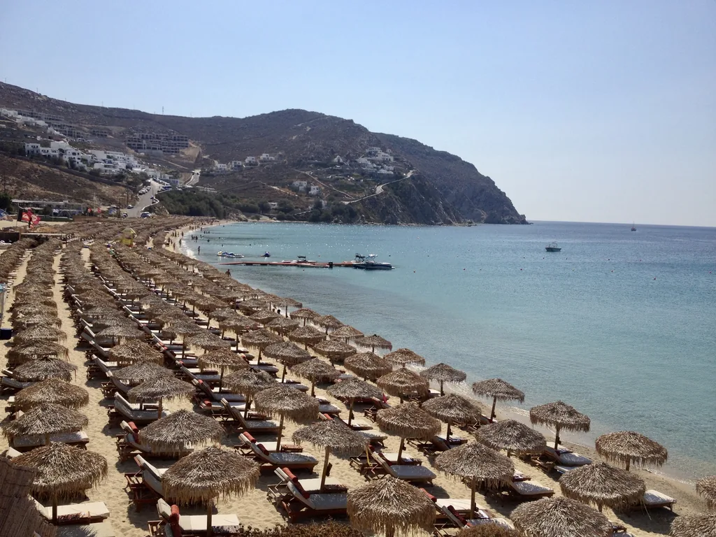 Rows of straw umbrellas along Elia beach, Mykonos