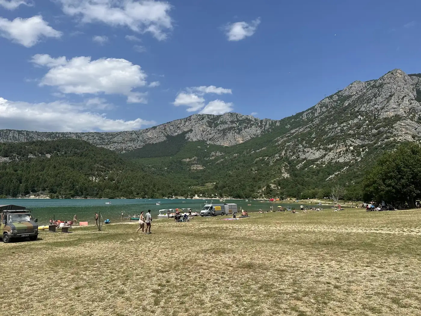 The shore of the Lac de Sainte-Croix with the mountains of the Verdon behind