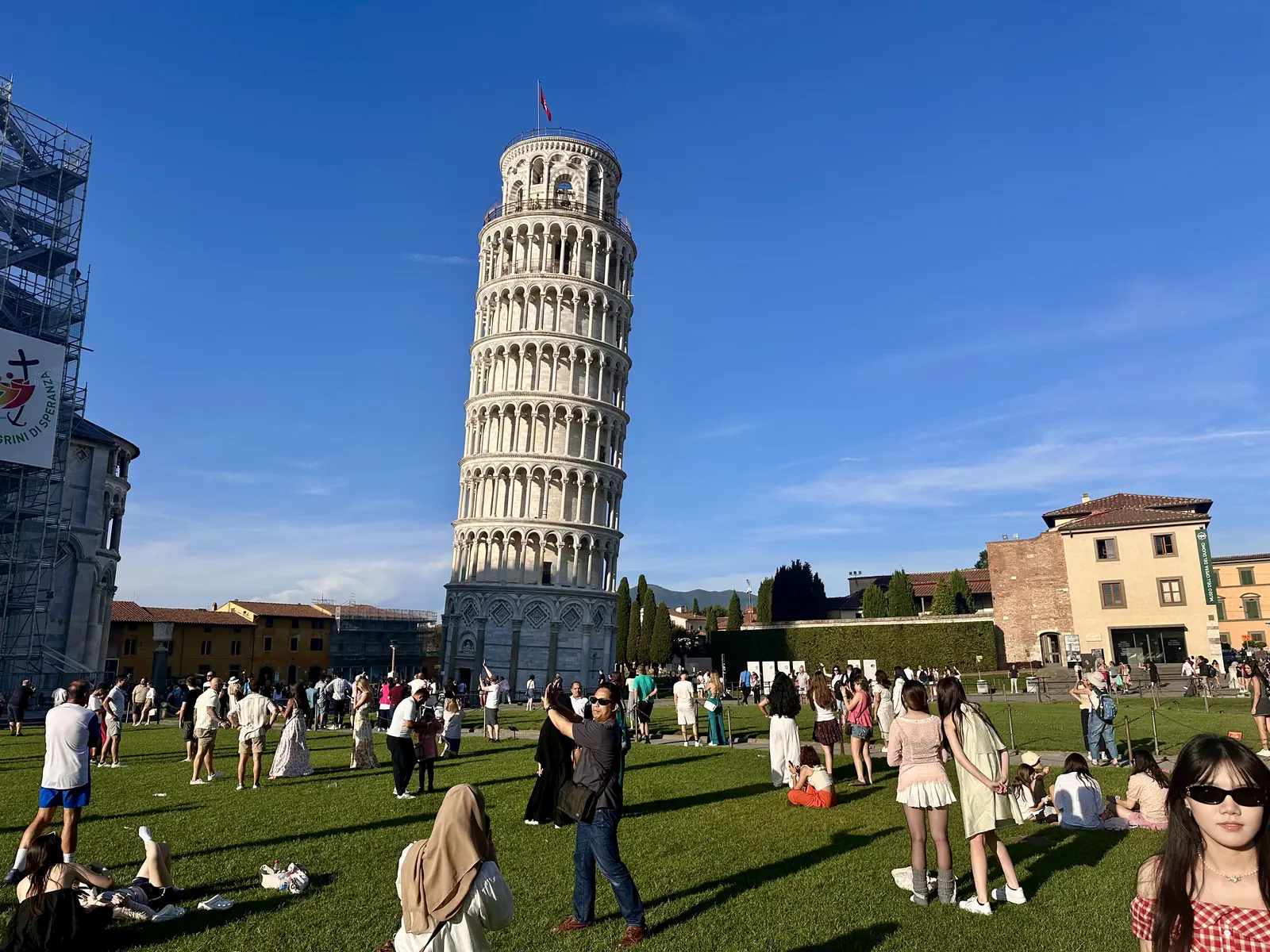 The Leaning Tower of Pisa above the lawn of the Piazza dei Miracoli