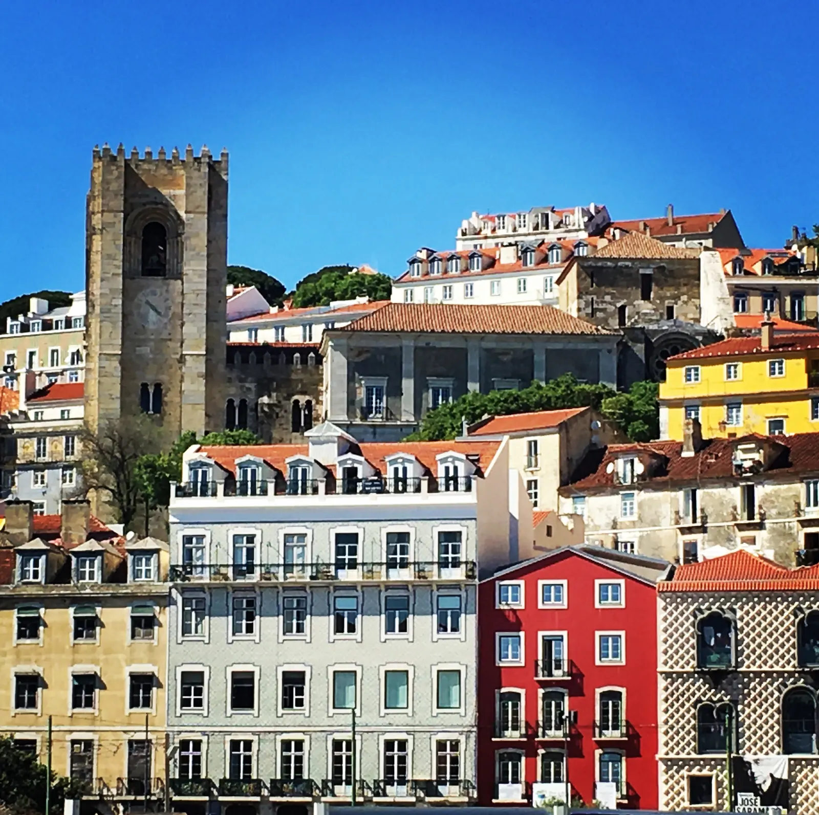 The towers of Lisbon Cathedral above colorful facades