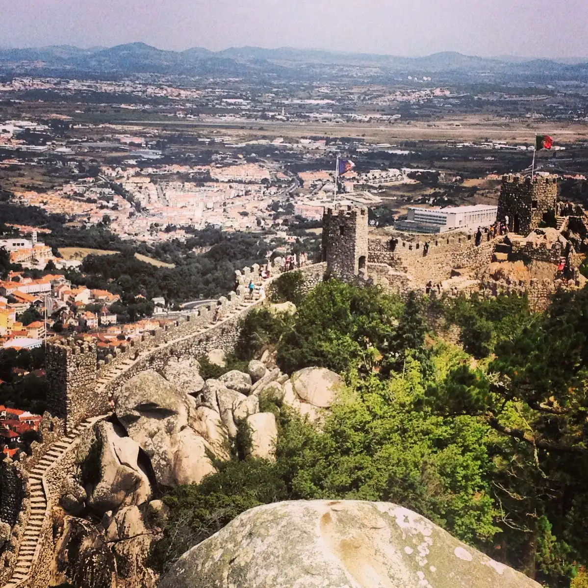 The walls of the Moorish Castle on the rocks above the town of Sintra