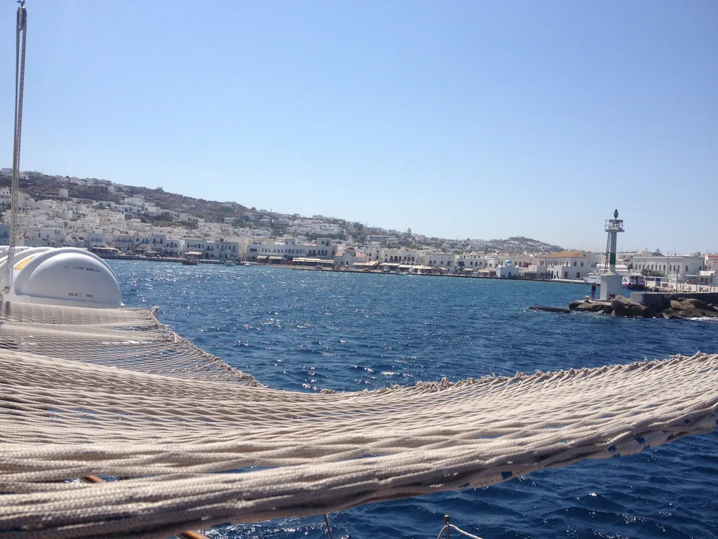 The old port of Mykonos seen from the deck of a boat leaving for Delos