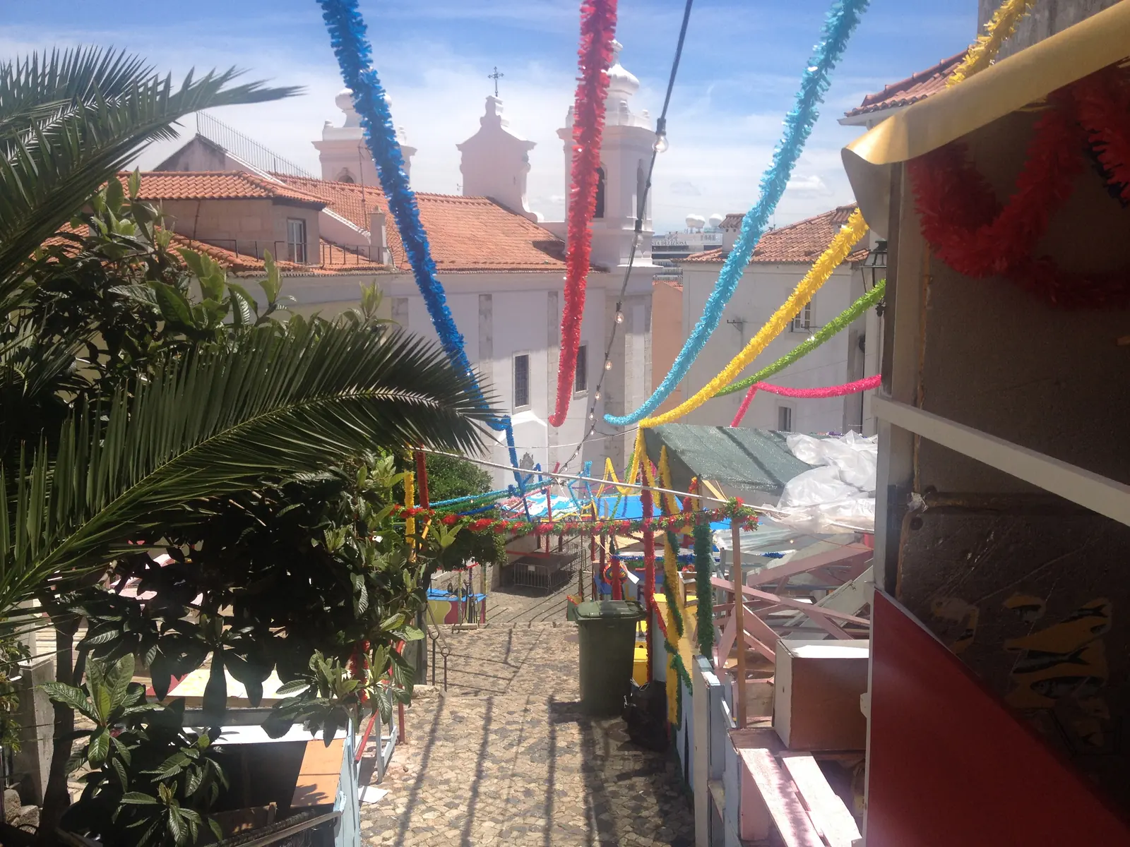 Colored streamers over a lane near Portas do Sol for the Santo António festival