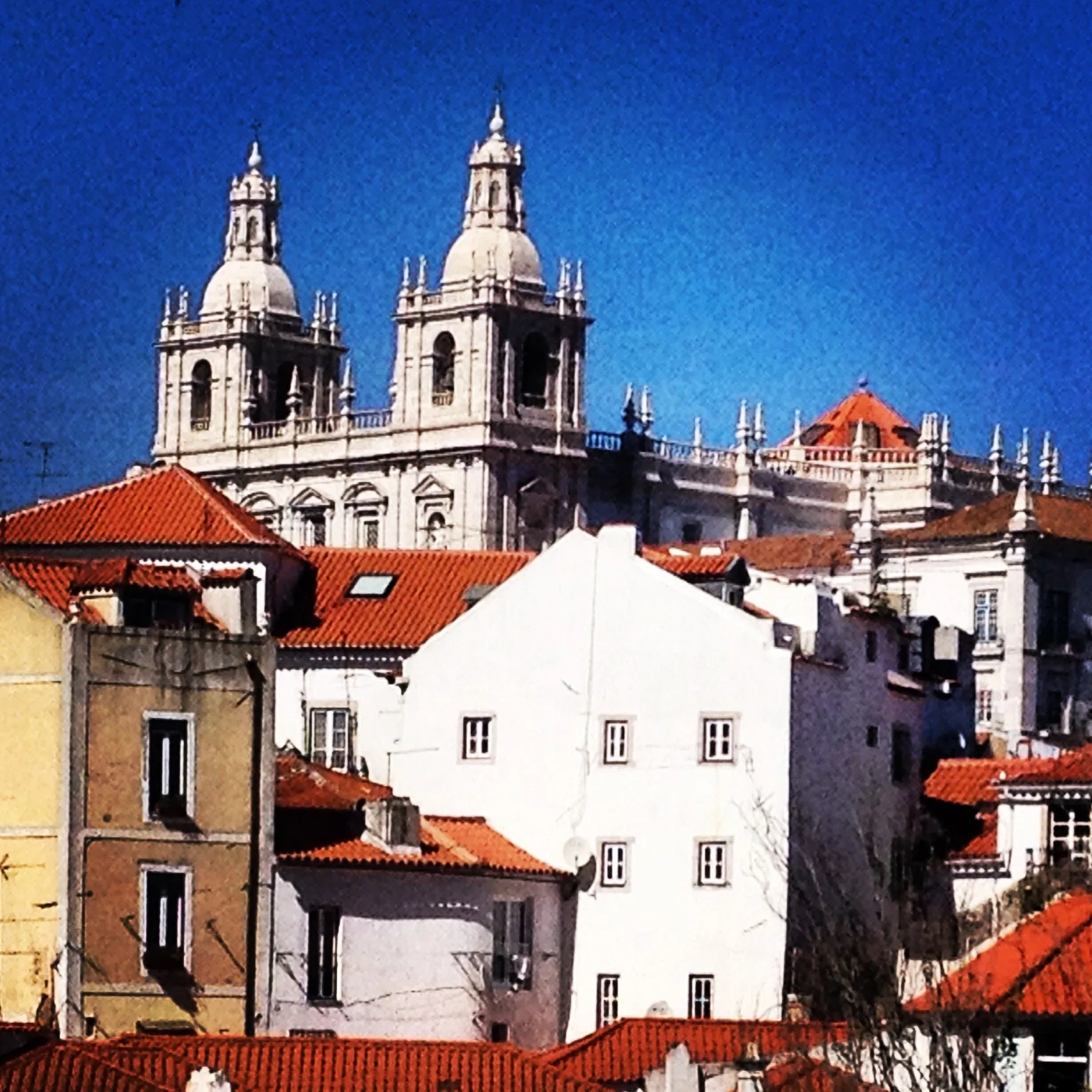 The twin towers of São Vicente de Fora above the houses of Alfama in Lisbon