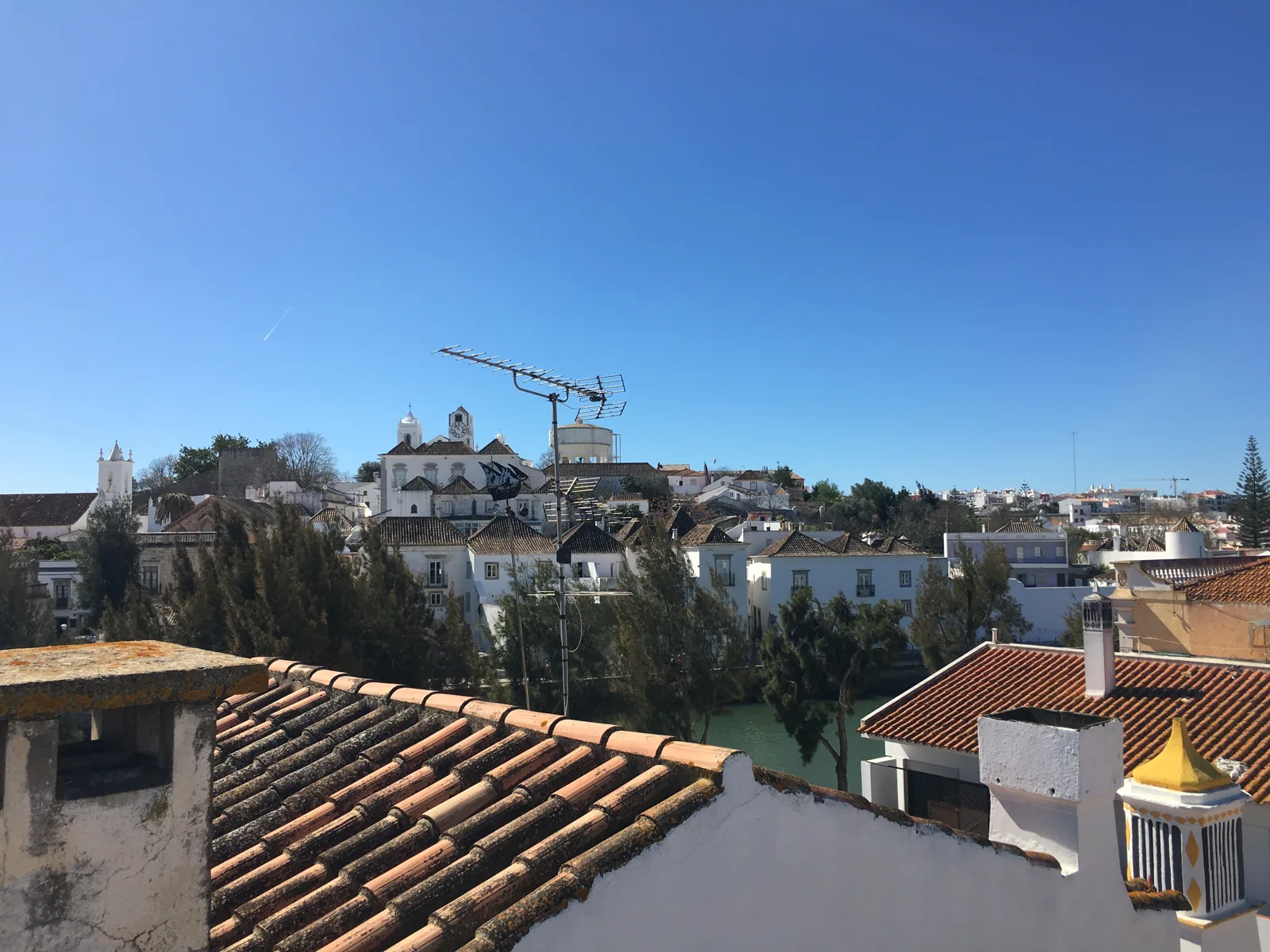 The tiled roofs and church towers of Tavira