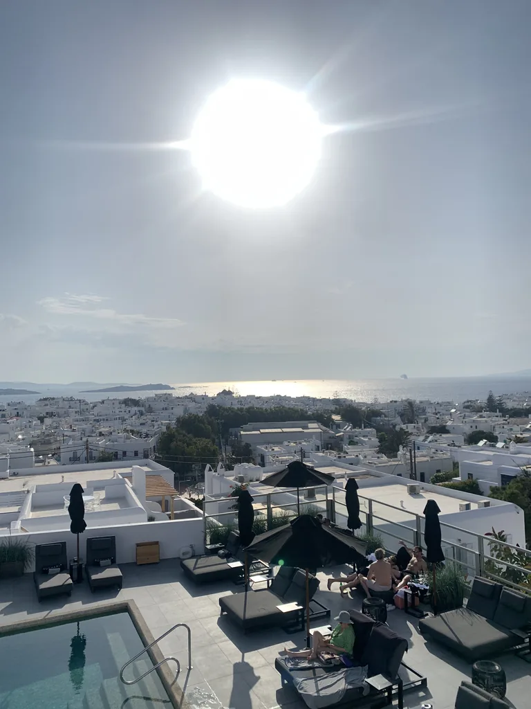 View over Mykonos Town and the sea from the pool of the Rochari Hotel